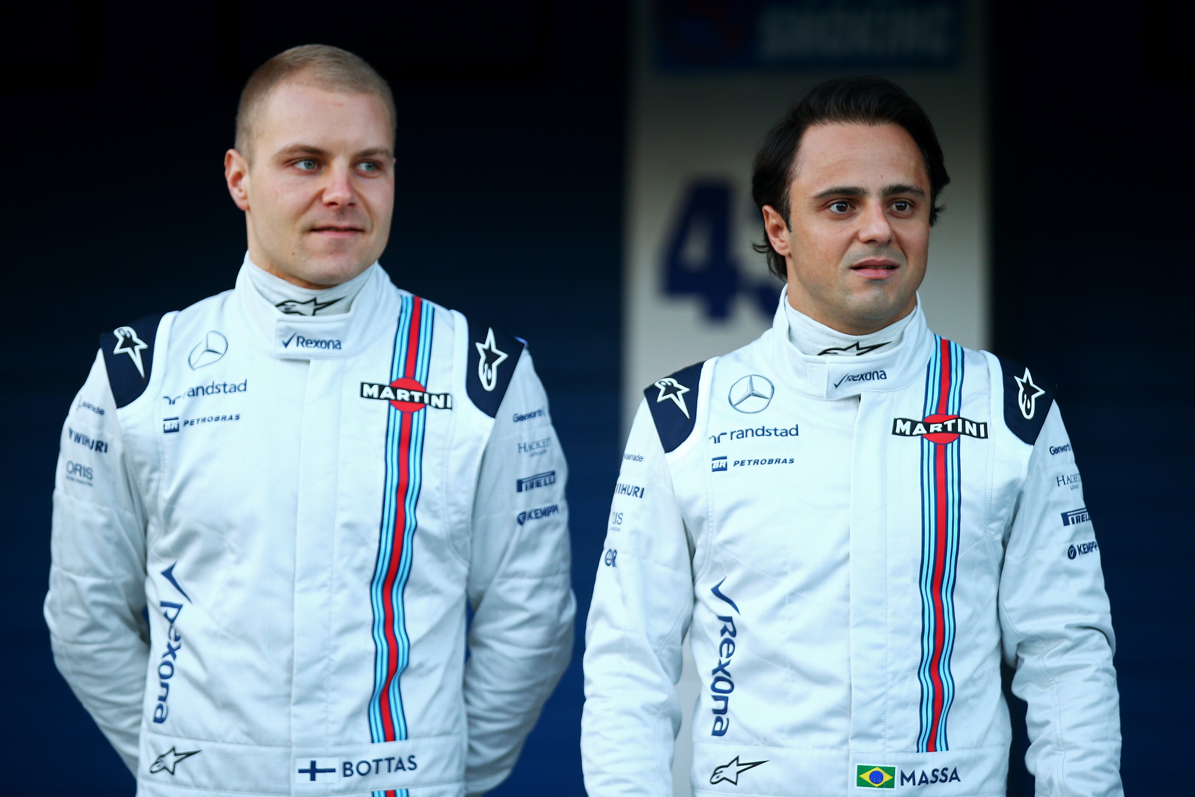 JEREZ DE LA FRONTERA, SPAIN - FEBRUARY 01:  Felipe Massa of Brazil and Williams and Valtteri Bottas of Finland and Williams pose with the new FW37 outside the garage during day one of Formula One Winter Testing at Circuito de Jerez on February 1, 2015 in Jerez de la Frontera, Spain.  (Photo by Mark Thompson/Getty Images)
