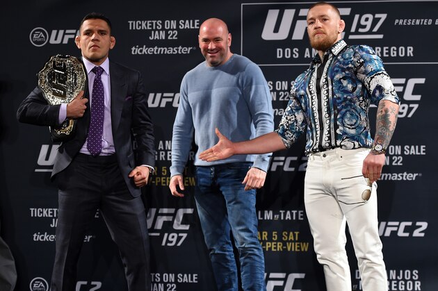 LAS VEGAS, NV - JANUARY 20:  UFC President Dana White squares off Rafael dos Anjos of Brazil (L) and Conor McGregor of Ireland (R) during the UFC 197 on-sale press conference event inside MGM Grand Hotel & Casino on January 20, 2016 in Las Vegas, Nevada. (Photo by Jeff Bottari/Zuffa LLC/Zuffa LLC via Getty Images)