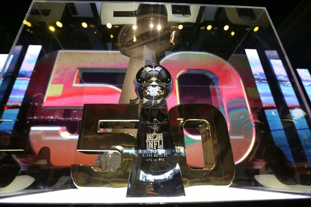 The Vince Lombardi Trophy is displayed inside the NFL Experience Tuesday, Feb. 2, 2016, in San Francisco. The Denver Broncos will play the Carolina Panthers in Super Bowl 50 Sunday, Feb. 7, 2016. (AP Photo/David J. Phillip)
