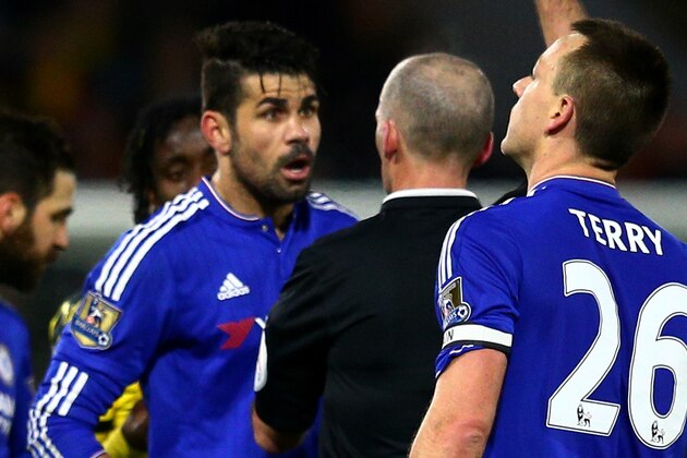 WATFORD, ENGLAND - FEBRUARY 03:  Referee Mike Dean shows the yellow card to Diego Costa of Chelsea during the Barclays Premier League match between Watford and Chelsea at Vicarage Road on February 3, 2016 in Watford, England.  (Photo by Clive Mason/Getty Images)