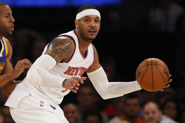 Golden State Warriors forward Andre Iguodala (9) defends New York Knicks forward Carmelo Anthony (7) in the first half of an NBA basketball game at Madison Square Garden in New York, Sunday, Jan. 31, 2016. (AP Photo/Kathy Willens)