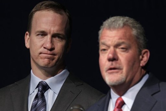 Quarterback Peyton Manning, left, listens as Indianapolis Colts owner Jim Irsay announces that the NFL football team will release quarterback Peyton Manning during a news conference in Indianapolis, Wednesday, March 7, 2012. (AP Photo/Michael Conroy)
