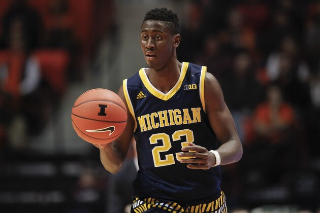 CHAMPAIGN, IL - DECEMBER 30: Caris LeVert #23 of the Michigan Wolverines brings the ball up court during the game against the Illinois Fighting Illini at State Farm Center on December 30, 2015 in Champaign, Illinois.  (Photo by Michael Hickey/Getty Images)