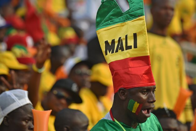 Malian supporters cheer their team during the 2015 African Cup of Nations group D football match between Guinea and Mali in Mongomo, on January 28, 2015. AFP PHOTO / CARL DE SOUZA (Photo credit should read CARL DE SOUZA/AFP/Getty Images) Malian supporters cheer their team during the 2015 African Cup of Nations group D football match between Guinea and Mali in Mongomo, on January 28, 2015. AFP PHOTO / CARL DE SOUZA (Photo credit should read CARL DE SOUZA/AFP/Getty Images)