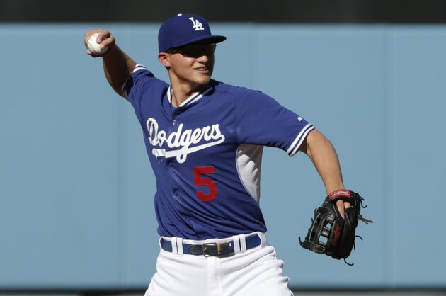 Los Angeles Dodgers shortstop Corey Seager warms up before Game 2 of baseball's National League Division Series against the New York Mets, Saturday, Oct. 10, 2015 in Los Angeles. (AP Photo/Lenny Ignelzi)
