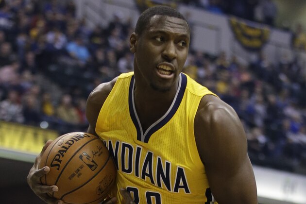 Indiana Pacers' Ian Mahinmi (28) grabs a rebound during the first half of an NBA basketball game against the Indiana Pacers,  Wednesday, Dec. 16, 2015, in Indianapolis. (AP Photo/Darron Cummings)