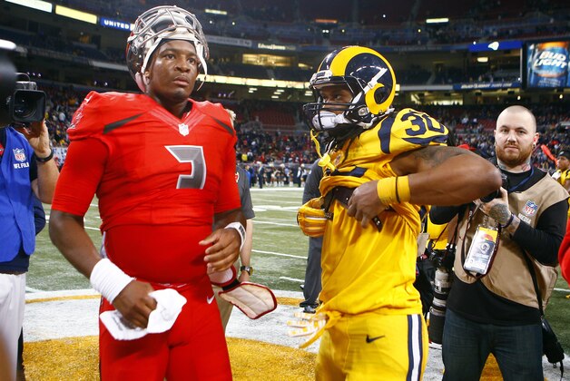 Tampa Bay Buccaneers quarterback Jameis Winston, left, and St. Louis Rams running back Todd Gurley exchange jerseys following an NFL football game between the St. Louis Rams and the Tampa Bay Buccaneers on Thursday, Dec. 17, 2015, in St. Louis. The Rams won 31-23. (AP Photo/Billy Hurst)