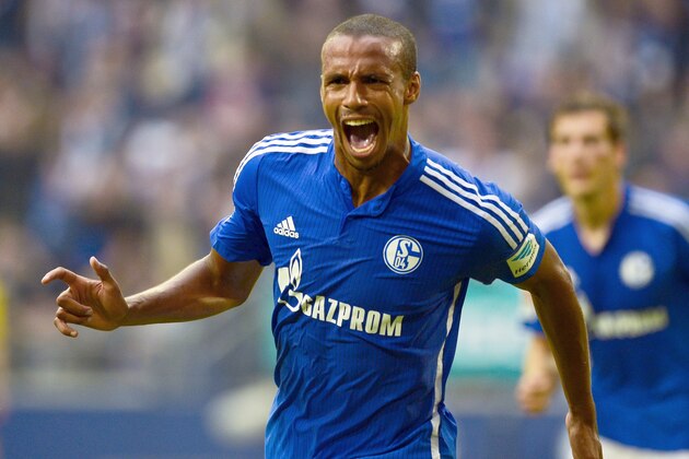 Schalke's Cameroonian defender Joel Matip celebrates after scoring the 1-0 goal during the German first division Bundesliga football match FC Schalke 04 v 1 FSV Mainz 05, in Gelsenkirchen, on September 13, 2015.  AFP PHOTO / SASCHA SCHUERMANN  RESTRICTIONS: DURING MATCH TIME: DFL RULES TO LIMIT THE ONLINE USAGE TO 15 PICTURES PER MATCH AND FORBID IMAGE SEQUENCES TO SIMULATE VIDEO.  == RESTRICTED TO EDITORIAL USE == FOR FURTHER QUERIES PLEASE CONTACT DFL DIRECTLY AT + 49 69 650050.        (Photo credit should read SASCHA SCHUERMANN/AFP/Getty Images)