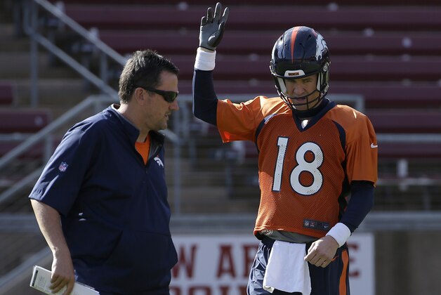 Denver Broncos quarterback Peyton Manning (18) and quarterbacks coach Greg Knapp during an NFL football practice in Stanford, Calif., Thursday, Feb. 4, 2016. (AP Photo/Jeff Chiu)