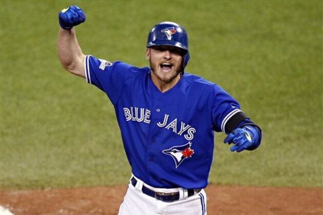 FILE- In this Oct. 19, 2015, file photo, Toronto Blue Jays' Josh Donaldson celebrates his two run home run against the Kansas City Royals during the third inning in Game 3 of baseball's American League Championship Series in Toronto. Cy Young Award winners Jake Arrieta of the Chicago Cubs and Dallas Keuchel of the Houston Astros were among 156 players who filed for salary arbitration Tuesday, Jan. 12, 2016, and are set to swap proposed figures with their teams this week unless they agree to contracts. Donaldson also filed. (AP Photo/Paul Sancya, File)