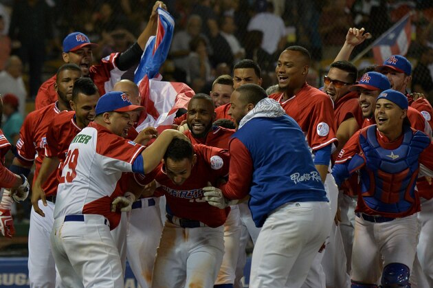 Neftali Soto (C) of Puerto Rican celebrates a homerun definitive against Dominican Republic during their 2016 Caribbean baseball series game, on February 4, In Santo Domingo city, Dominican Republic.   
 / AFP / YAMIL LAGE        (Photo credit should read YAMIL LAGE/AFP/Getty Images)