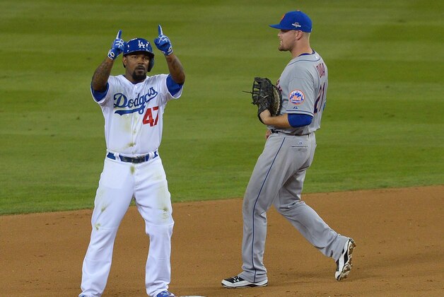 October 9, 2015; Los Angeles, CA, USA; Los Angeles Dodgers second baseman Howie Kendrick (47) reacts after reaching second on a double in the eighth inning against the New York Mets in game one of the NLDS at Dodger Stadium. Mandatory Credit: Richard Mackson-USA TODAY Sports