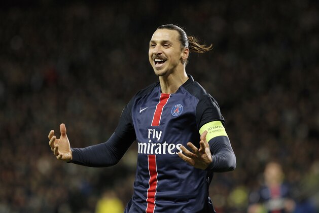 Paris Saint Germain's Zlatan Ibrahimovic celebrates after he scored a goal against Saint-Etienne during their French League One soccer match in Saint-Etienne, central France, Sunday, Jan. 31, 2016. (AP Photo/Laurent Cipriani)