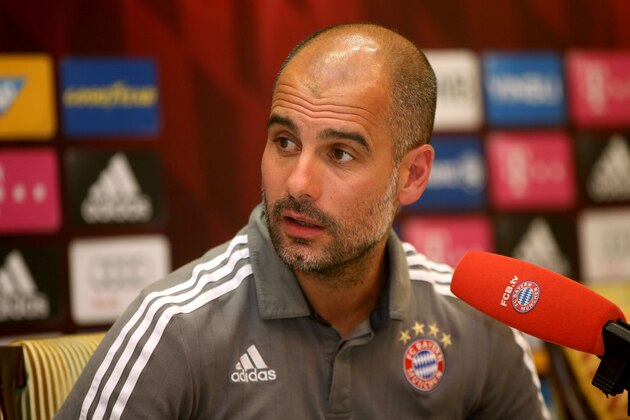 Bayern Munich's Spanish head coach Pep Guardiola speaks during a press conference at Aspire Academ in the Qatari capital Doha on January 11, 2016. / AFP / STRINGER        (Photo credit should read STRINGER/AFP/Getty Images)