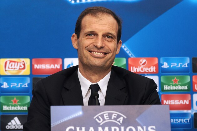 Juventus's Italian coach Massimiliano Allegri smiles during a press conference at the Ramon Snachez Pizjuan in Sevilla on December 7, 2015, on the eve of the UEFA Champions League Group D football match Sevilla FC vs Juventus.   AFP PHOTO/ CRISTINA QUICLER / AFP / CRISTINA QUICLER        (Photo credit should read CRISTINA QUICLER/AFP/Getty Images)