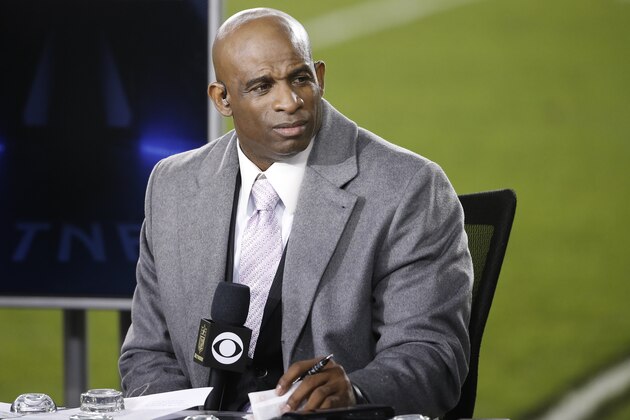 Former football player Deion Sanders is seen on a broadcast stage before an NFL football game between the Philadelphia Eagles and the Washington Redskins, Saturday, Dec. 26, 2015, in Philadelphia.  (AP Photo/Matt Rourke)
