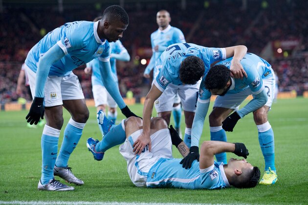 Manchester City's Argentinian striker Sergio Aguero (R) falls to the ground after hurting himself whilst scoring the opening goal of the English Premier League football match between Sunderland and Manchester City at the Stadium of Light in Sunderland, north east England on February 2, 2016.  / AFP / OLI SCARFF        (Photo credit should read OLI SCARFF/AFP/Getty Images)