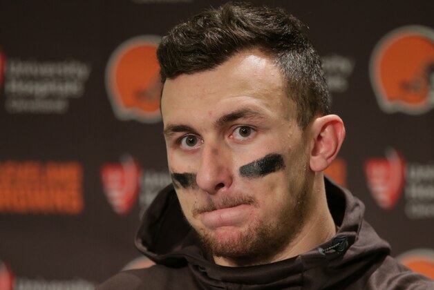 Cleveland Browns quarterback Johnny Manziel speaks with media members following the team's 30-13 loss to the Seattle Seahawks n an NFL football game, Sunday, Dec. 20, 2015, in Seattle.  (AP Photo/Scott Eklund)