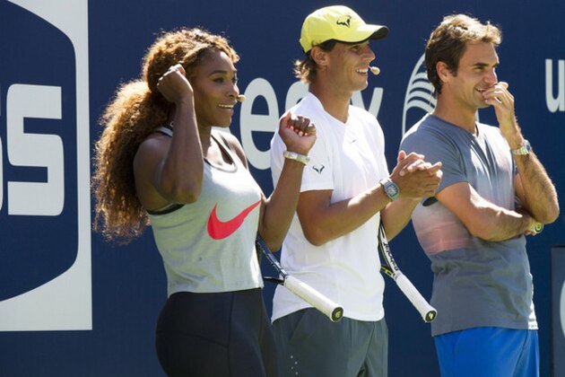 Serena Williams, from left, Rafael Nadal and Roger Federer cheer on the competition at the 18th Annual Arthur Ashe Kids’ Day, the kick off to the 2013 US Open tennis tournament, on Saturday, Aug. 24, 2013 in New York. (Photo by Charles Sykes/Invision/AP)