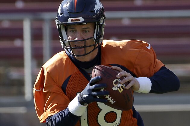 Denver Broncos quarterback Peyton Manning (18) rolls out to pass during an NFL football practice in Stanford, Calif., Thursday, Feb. 4, 2016. (AP Photo/Jeff Chiu)