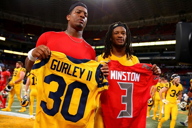 ST. LOUIS, MO - DECEMBER 17: Todd Gurley #30 of the St. Louis Rams and Jameis Winston #3 of the Tampa Bay Buccaneers pose after exchanging jerseys after a game at the Edward Jones Dome on December 17, 2015 in St. Louis, Missouri. (Photo by Dilip Vishwanat/Getty Images)