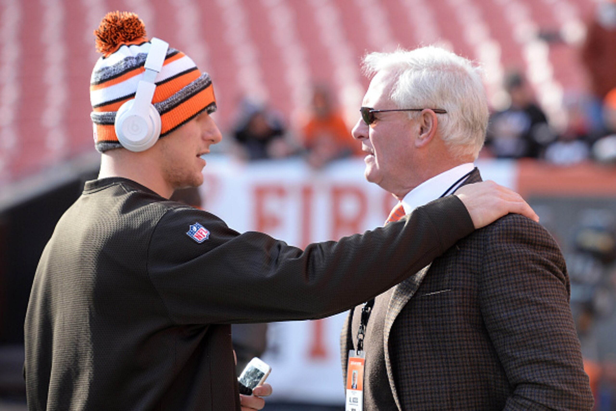 CLEVELAND, OH - DECEMBER 07:  Johnny Manziel #2 of the Cleveland Browns talks with owner Jimmy Haslam prior to the game against the Indianapolis Colts at FirstEnergy Stadium on December 7, 2014 in Cleveland, Ohio.  (Photo by Jason Miller/Getty Images)