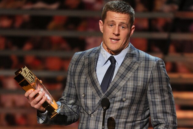 J.J. Watt, of the Houston Texans, accepts the AP defensive player of the year award on stage at the 4th annual NFL Honors at the Phoenix Convention Center Symphony Hall on Saturday, Jan. 1, 2015. (Photo by Frank Micelotta/Invision for NFL/AP Images)