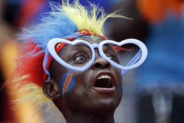 FILE - A Saturday, Jan. 31, 2015 file photo showing a Democratic Republic of Congo soccer fan cheering on his team during the African Cup of Nations quarter final soccer match between Congo and DR Congo in Bata, Equatorial Guinea. (AP Photo/Themba Hadebe, File)