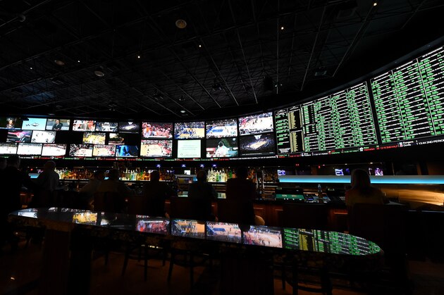 LAS VEGAS, NV - FEBRUARY 02:  The betting line and some of the nearly 400 proposition bets for Super Bowl 50 between the Carolina Panthers and the Denver Broncos are displayed at the Race & Sports SuperBook at the Westgate Las Vegas Resort & Casino on February 2, 2016 in Las Vegas, Nevada. The newly renovated sports book has the world's largest indoor LED video wall with 4,488 square feet of HD video screens measuring 240 feet wide and 20 feet tall.  (Photo by Ethan Miller/Getty Images)