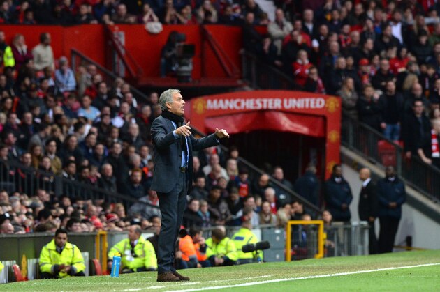 Chelsea's Portuguese manager Jose Mourinho gestures during the English Premier League football match between Manchester United and Chelsea at Old Trafford in Manchester, north west England, on October 26, 2014.  AFP PHOTO / PAUL ELLIS 

RESTRICTED TO EDITORIAL USE. No use with unauthorized audio, video, data, fixture lists, club/league logos or live services. Online in-match use limited to 45 images, no video emulation. No use in betting, games or single club/league/player publications.        (Photo credit should read PAUL ELLIS/AFP/Getty Images)