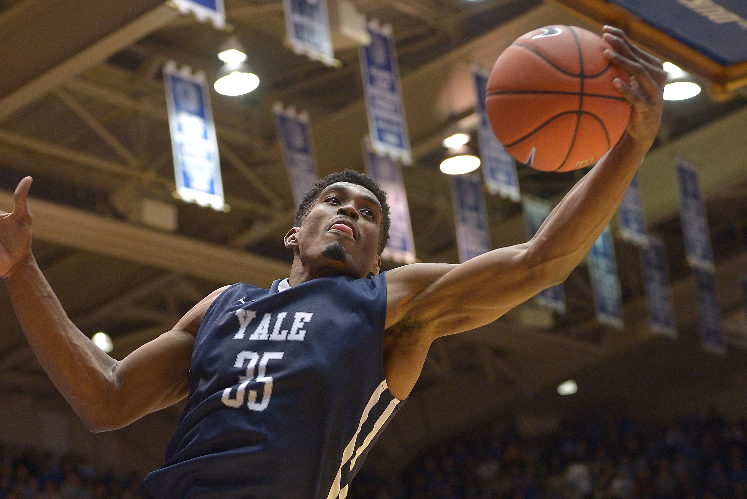DURHAM, NC - NOVEMBER 25:  Brandon Sherrod #35 of the Yale Bulldogs rebounds against the Duke Blue Devils during their game at Cameron Indoor Stadium on November 25, 2015 in Durham, North Carolina. Duke won 80-61.  (Photo by Grant Halverson/Getty Images)
