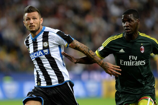 UDINE, ITALY - SEPTEMBER 22:  Cyril Thereau (L) of Udinese Calcio competes with Cristian Zapata of AC Milan during the Serie A match between Udinese Calcio and AC Milan at Stadio Friuli on September 22, 2015 in Udine, Italy.  (Photo by Dino Panato/Getty Images)