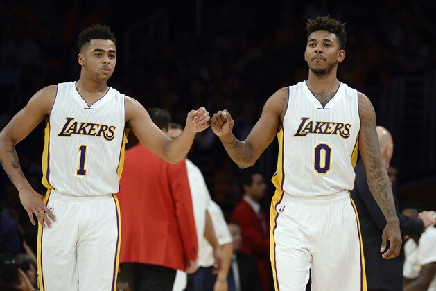 LOS ANGELES, CA - NOVEMBER 22: D'Angelo Russell #1 and Nick Young #0 of the Los Angeles Lakers pump fists during the second half of the basketball game against Portland Trail Blazers at Staples Center November 22, 2015 in Los Angeles, California. NOTE TO USER: User expressly acknowledges and agrees that, by downloading and or using the photograph, User is consenting to the terms and conditions of the Getty Images License Agreement. (Photo by Kevork Djansezian/Getty Images)