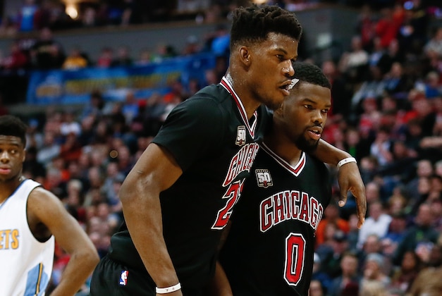 Feb 5, 2016; Denver, CO, USA; Chicago Bulls guard Aaron Brooks (0) helps guard Jimmy Butler (21) off the court in the second quarter against the Denver Nuggets at the Pepsi Center. Mandatory Credit: Isaiah J. Downing-USA TODAY Sports