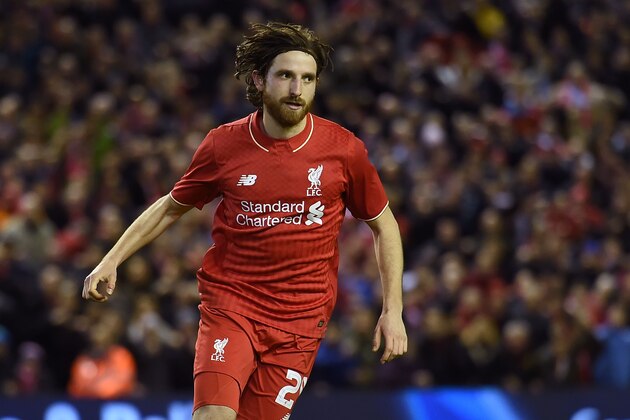 Liverpool's Welsh midfielder Joe Allen celebrates scoring the winning penalty in the shoot-out after the English League Cup semi-final second leg football match between Liverpool and Stoke City at Anfield in Liverpool, north west England, on January 26, 2016. Liverpool won the two legged semi-final 6-5 on penalties, after a 1-0 Stoke victory in 90 minutes meant the tie finished 1-1 after extra time. / AFP / Paul ELLIS / RESTRICTED TO EDITORIAL USE. No use with unauthorized audio, video, data, fixture lists, club/league logos or 'live' services. Online in-match use limited to 75 images, no video emulation. No use in betting, games or single club/league/player publications.  /         (Photo credit should read PAUL ELLIS/AFP/Getty Images)