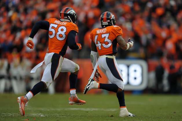 DENVER, CO - JANUARY 24:  Von Miller #58 and T.J. Ward #43 of the Denver Broncos run off the field and celebrate after the New England Patriots turned the ball over on downs  in the AFC Championship game at Sports Authority Field at Mile High on January 24, 2016 in Denver, Colorado.  (Photo by Dustin Bradford/Getty Images)