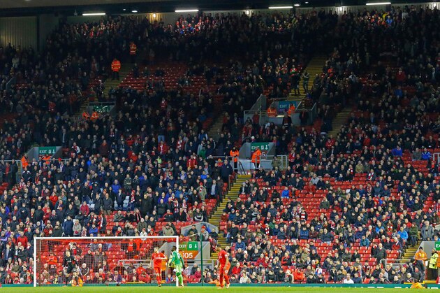 Liverpool fans leave the stands at the Kop End after 77 minutes' of play during the English Premier League football match between Liverpool and Sunderland at Anfield in Liverpool, northwest England, on February 6, 2016, in protest against the recent announcement that prices would rise to £77. / AFP / LINDSEY PARNABY / RESTRICTED TO EDITORIAL USE. No use with unauthorized audio, video, data, fixture lists, club/league logos or 'live' services. Online in-match use limited to 75 images, no video emulation. No use in betting, games or single club/league/player publications.  /         (Photo credit should read LINDSEY PARNABY/AFP/Getty Images)