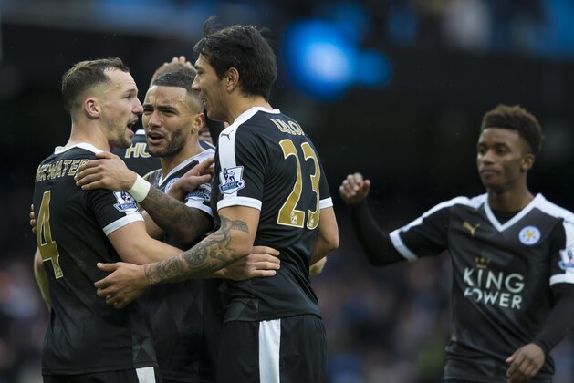 Leicester City players including Daniel Drinkwater, left, and Leonardo Ulloa, cenre left, clelebrate afrer their 3-1 win against Manchester City in the English Premier League soccer match between Manchester City and Leicester City at the Etihad Stadium in Manchester, England, Saturday Feb. 6, 2016. (AP Photo/Jon Super)