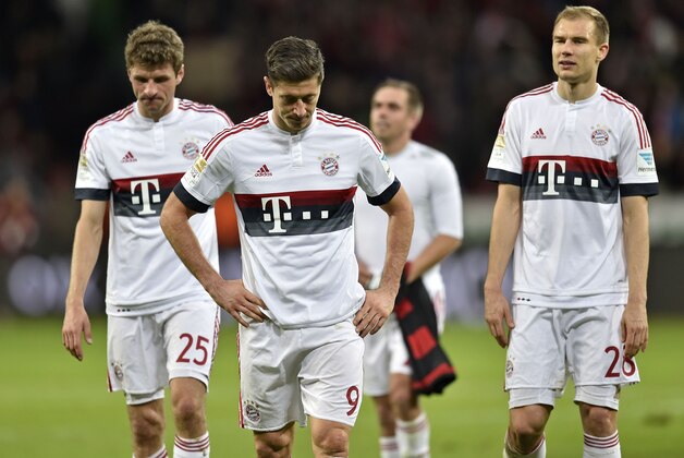 Bayern's Robert Lewandowski, center, Thomas Mueller, left, and Holger Badstuber leave the pitch disappointed after  the German Bundesliga soccer match between Bayer Leverkusen and Bayern Munich in Leverkusen, Germany, Saturday, Feb. 6, 2016. The match ended 0-0. (AP Photo/Martin Meissner)