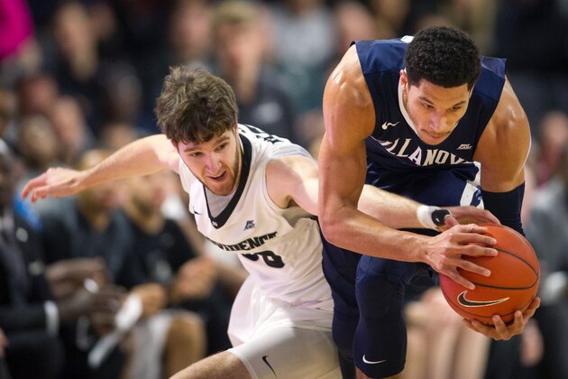 Villanova guard Josh Hart, right, and Providence guard Ryan Fazekas, left, reach for a loose ball during the first half of an NCAA basketball game, Saturday, Feb. 6, 2016, in Providence, R.I.  (AP Photo/Gretchen Ertl)