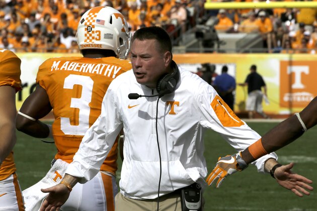 Tennessee head coach Butch Jones celebrates with players during the first quarter of the Outback Bowl NCAA college football against Northwestern game Friday, Jan. 1, 2016, in Tampa, Fla. (AP Photo/Chris O'Meara)