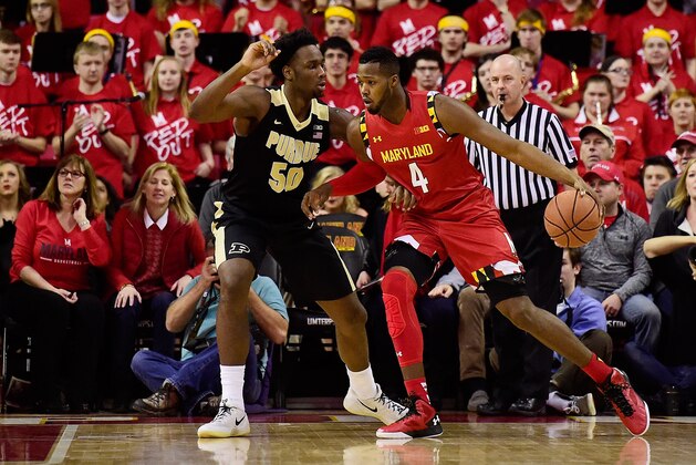 COLLEGE PARK, MD - FEBRUARY 06:  Robert Carter #4 of the Maryland Terrapins dribbles the ball against Caleb Swanigan #50 of the Purdue Boilermakers in the first half during their game at Xfinity Center on February 6, 2016 in College Park, Maryland.  (Photo by Patrick McDermott/Getty Images)