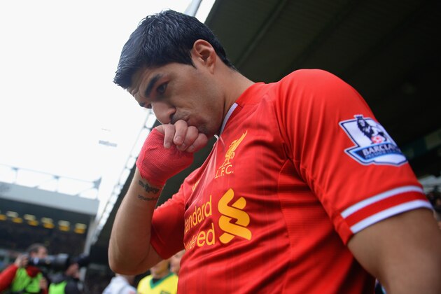 NORWICH, ENGLAND - APRIL 20:  Luis Suarez of Liverpool kisses his hand as he walks out during the Barclays Premier League match between Norwich City and Liverpool at Carrow Road on April 20, 2014 in Norwich, England.  (Photo by Michael Regan/Getty Images)