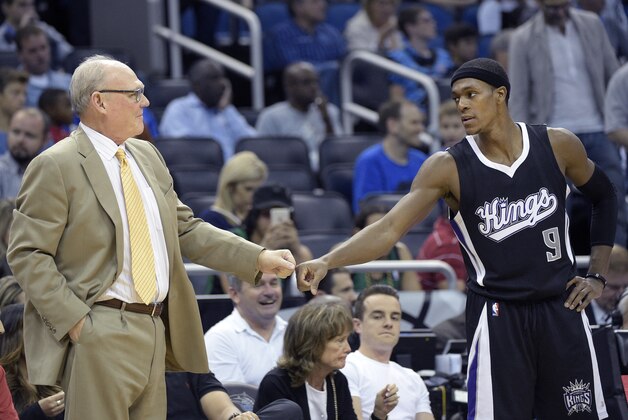 Sacramento Kings head coach George Karl, left, and guard Rajon Rondo (9) share a fist-bump during the second half of an NBA basketball game against the Orlando Magic in Orlando, Fla., Saturday, Nov. 21, 2015. The Kings won 97-91. (AP Photo/Phelan M. Ebenhack)