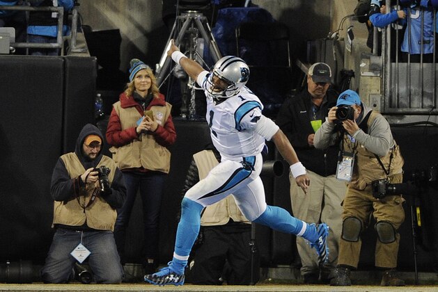 Carolina Panthers' Cam Newton celebrates his touchdown run during the first half the NFL football NFC Championship game against the Arizona Cardinals, Sunday, Jan. 24, 2016, in Charlotte, N.C. (AP Photo/Mike McCarn)