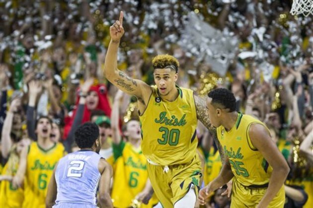 Notre Dame’s Zach Auguste (30) celebrates after scoring the team's first basket of the night against North Carolina, in an NCAA college basketball game Saturday, Feb. 6, 2016, in South Bend, Ind. (AP Photo/Robert Franklin)