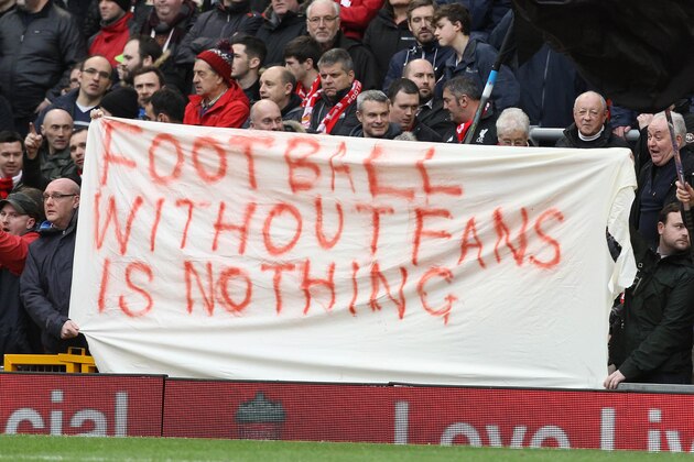 Liverpool fans hold a banner as they protest against the recently announced rise in ticket prices during the English Premier League football match between Liverpool and Sunderland at Anfield in Liverpool, northwest England, on February 6, 2016. / AFP / LINDSEY PARNABY / RESTRICTED TO EDITORIAL USE. No use with unauthorized audio, video, data, fixture lists, club/league logos or 'live' services. Online in-match use limited to 75 images, no video emulation. No use in betting, games or single club/league/player publications.  /         (Photo credit should read LINDSEY PARNABY/AFP/Getty Images)