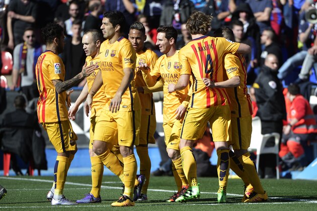 Barcelona's players celebrate their first goal during the Spanish league football match Levante UD vs FC Barcelona at the Ciutat de Valencia stadium in Valencia on February 7, 2016. AFP PHOTO / JOSE JORDAN / AFP / JOSE JORDAN        (Photo credit should read JOSE JORDAN/AFP/Getty Images)