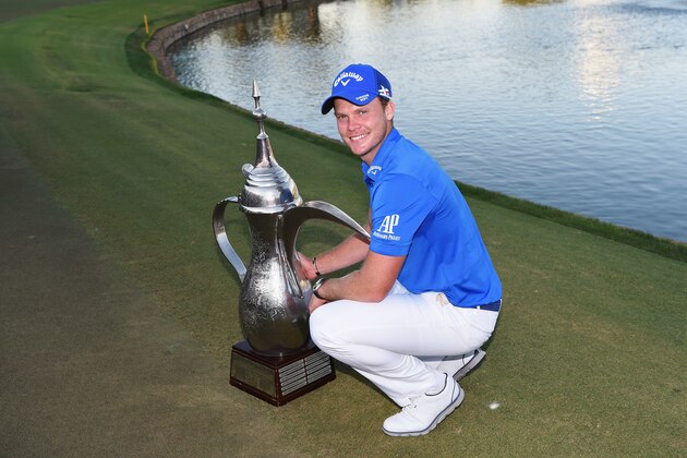 DUBAI, UNITED ARAB EMIRATES - FEBRUARY 07:  Danny Willett of England poses with the trophy after his victory in the Omega Dubai Desert Classic at the Emirates Golf Club on February 7, 2016 in Dubai, United Arab Emirates.  (Photo by Ross Kinnaird/Getty Images)
