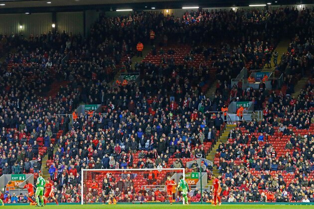 Liverpool fans leave the stands at the Kop End after 77 minutes' of play during the English Premier League football match between Liverpool and Sunderland at Anfield in Liverpool, northwest England, on February 6, 2016, in protest against the recent announcement that prices would rise to £77. / AFP / LINDSEY PARNABY / RESTRICTED TO EDITORIAL USE. No use with unauthorized audio, video, data, fixture lists, club/league logos or 'live' services. Online in-match use limited to 75 images, no video emulation. No use in betting, games or single club/league/player publications.  /         (Photo credit should read LINDSEY PARNABY/AFP/Getty Images)